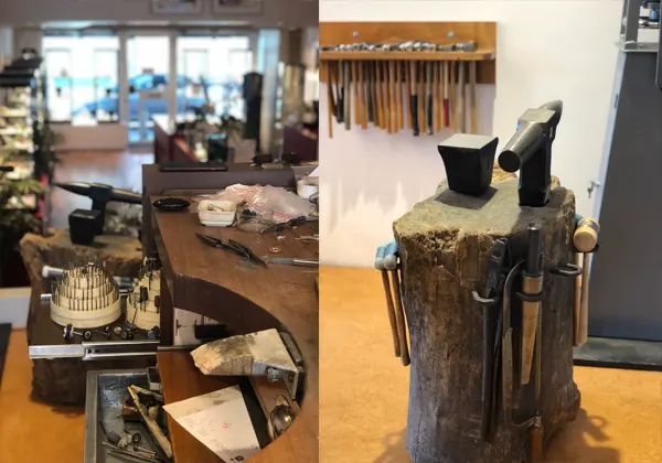 Werkbank en een houten blok met aambeeld en hamers